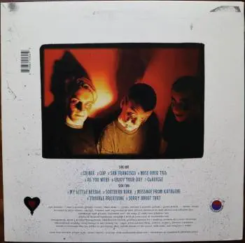 <u>PRESSING INFO</u><br><table class=inf_press><tbody><tr class=inf_info><td class=inf_title>Album:</td><td class=inf_info> Goddamnit Redux on Half Green / Half Yellow with White Splatter  </td></tr>
    <td class=inf_title>Pressing:</td><td> First Pressing /500  </td></tr>
    <td class=inf_title>Release Date:</td><td> Mar. 11th 2008  </td></tr>
    <td class=inf_title>Album Pressed:</td><td> 2008  </td></tr>
    <td class=inf_title>Label:</td><td> Asianman Records AM-160  </td></tr>
    <td class=inf_title>Insert:</td><td> Double Sided Glossy  </td></tr>
    <td class=inf_title>Barcode:</td><td> 6 12851-01601 9  </td></tr>
    <td class=inf_title>Side A Matrix:</td><td> 74940E1/B GOD  </td></tr>
    <td class=inf_title>Side B Matrix:</td><td> 74940E2/A DAMNIT!  </td></tr>
    <td class=inf_title>&nbsp;</td><td> <a href=https://www.discogs.com/release/2465168-Alkaline-Trio-Goddamnit target=_blank rel=noopener noreferrer>View This Release on Discogs</a>  </tr></tbody></table>
<br><u>PRICING</u><span class='less' style='padding-left: 8px; color: var(--font-colour_grey);'>(prices shown in USD)</span><br><table class='inf_press'><tbody><tr class='inf_info'>
            <td class='inf_title'>Last Sold:</td>
            <td>$50.00 (Aug 13, 2021)</td>
            </tr><tr class='inf_info'>
            <td class='inf_title'>History:</td>
            <td>
                <span class='price-low' title='Sold on Jul 22, 2016'>Low: <span class='price-value'>$15.00</span></span>
                <span class='price-separator'>|</span>
                <span class='price-avg'>Avg: <span class='price-value'>$31.42</span></span>
                <span class='price-separator'>|</span>
                <span class='price-high' title='€44.00 · Sold on Jul 19, 2020'>High: <span class='price-value'>$50.11</span></span>
            </td>
            </tr></tbody></table><br>    <br><br><u>TRACKLIST</u><br><table class='inf_tracks'><tbody><tr>
            <td class='inf_num'>A1</td>
            <td class='inf_trk'>Cringe</td>
            <td class='inf_len'>2:23</td>
            <td><a href='#' class='lyric-link' data-album-code='gd' data-song-title='Cringe'>Lyrics</a></td></tr><tr>
            <td class='inf_num'>A2</td>
            <td class='inf_trk'>Cop</td>
            <td class='inf_len'>2:18</td>
            <td><a href='#' class='lyric-link' data-album-code='gd' data-song-title='Cop'>Lyrics</a></td></tr><tr>
            <td class='inf_num'>A3</td>
            <td class='inf_trk'>San Francisco</td>
            <td class='inf_len'>3:52</td>
            <td><a href='#' class='lyric-link' data-album-code='gd' data-song-title='San Francisco'>Lyrics</a></td></tr><tr>
            <td class='inf_num'>A4</td>
            <td class='inf_trk'>Nose Over Tail</td>
            <td class='inf_len'>2:37</td>
            <td><a href='#' class='lyric-link' data-album-code='gd' data-song-title='Nose Over Tail'>Lyrics</a></td></tr><tr>
            <td class='inf_num'>A5</td>
            <td class='inf_trk'>As You Were</td>
            <td class='inf_len'>2:11</td>
            <td><a href='#' class='lyric-link' data-album-code='gd' data-song-title='As You Were'>Lyrics</a></td></tr><tr>
            <td class='inf_num'>A6</td>
            <td class='inf_trk'>Enjoy Your Day</td>
            <td class='inf_len'>2:17</td>
            <td><a href='#' class='lyric-link' data-album-code='gd' data-song-title='Enjoy Your Day'>Lyrics</a></td></tr><tr>
            <td class='inf_num'>A7</td>
            <td class='inf_trk'>Clavicle</td>
            <td class='inf_len'>2:28</td>
            <td><a href='#' class='lyric-link' data-album-code='gd' data-song-title='Clavicle'>Lyrics</a></td></tr><tr>
            <td class='inf_num'>B1</td>
            <td class='inf_trk'>My Little Needle</td>
            <td class='inf_len'>3:01</td>
            <td><a href='#' class='lyric-link' data-album-code='gd' data-song-title='My Little Needle'>Lyrics</a></td></tr><tr>
            <td class='inf_num'>B2</td>
            <td class='inf_trk'>Southern Rock</td>
            <td class='inf_len'>3:05</td>
            <td><a href='#' class='lyric-link' data-album-code='gd' data-song-title='Southern Rock'>Lyrics</a></td></tr><tr>
            <td class='inf_num'>B3</td>
            <td class='inf_trk'>Message From Kathlene</td>
            <td class='inf_len'>3:22</td>
            <td><a href='#' class='lyric-link' data-album-code='gd' data-song-title='Message From Kathlene'>Lyrics</a></td></tr><tr>
            <td class='inf_num'>B4</td>
            <td class='inf_trk'>Trouble Breathing</td>
            <td class='inf_len'>3:55</td>
            <td><a href='#' class='lyric-link' data-album-code='gd' data-song-title='Trouble Breathing'>Lyrics</a></td></tr><tr>
            <td class='inf_num'>B5</td>
            <td class='inf_trk'>Sorry About That</td>
            <td class='inf_len'>3:21</td>
            <td><a href='#' class='lyric-link' data-album-code='gd' data-song-title='Sorry About That'>Lyrics</a></td></tr></tbody></table><br><br>
    <u>NOTES</u><br> This 1st pressing has a matte cover but the lettering and clocks on the front, as well as the track titles and Heart & Skull logo on the back, have a glossy finish.
 - Back