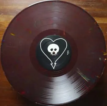<u>PRESSING INFO</u><br><table class=inf_press><tbody><tr class=inf_info><td class=inf_title>Album:</td><td class=inf_info> Goddamnit Redux on Random Colour 'Maroon with Rainbow Flecks' (Retail Exclusive)  </td></tr>
    <td class=inf_title>Pressing:</td><td> Eighteenth Pressing /500  </td></tr>
    <td class=inf_title>Release Date:</td><td> Mar. 1st 2022  </td></tr>
    <td class=inf_title>Album Pressed:</td><td> 2022  </td></tr>
    <td class=inf_title>Label:</td><td> Asianman Records AM-160  </td></tr>
    <td class=inf_title>Insert:</td><td> Double Sided Glossy  </td></tr>
    <td class=inf_title>Barcode:</td><td> 6 12851-01601 9  </td></tr>
    <td class=inf_title>Side A Matrix:</td><td> [etched] AM-160-A S-65748 [stamped] GOLDEN  </td></tr>
    <td class=inf_title>Side B Matrix:</td><td> [etched] AM-160-B S-65749 [stamped] GOLDEN  </td></tr>
    <td class=inf_title>&nbsp;</td><td> <a href=https://www.discogs.com/release/22437724-Alkaline-Trio-Goddamnit target=_blank rel=noopener noreferrer>View This Release on Discogs</a>  </tr></tbody></table>
<br><u>PRICING</u><span class='less' style='padding-left: 8px; color: var(--font-colour_grey);'>(prices shown in USD)</span><br><table class='inf_press'><tbody><tr class='inf_info'>
            <td class='inf_title'>Last Sold:</td>
            <td>$25.00 (Jul 3, 2026)</td>
            </tr><tr class='inf_info'>
            <td class='inf_title'>History:</td>
            <td>
                <span class='price-low' title='Sold on Apr 27, 2023'>Low: <span class='price-value'>$14.99</span></span>
                <span class='price-separator'>|</span>
                <span class='price-avg'>Avg: <span class='price-value'>$21.07</span></span>
                <span class='price-separator'>|</span>
                <span class='price-high' title='Sold on Jan 26, 2025'>High: <span class='price-value'>$30.00</span></span>
            </td>
            </tr></tbody></table><br>    <br><br><u>TRACKLIST</u><br><table class='inf_tracks'><tbody><tr>
            <td class='inf_num'>A1</td>
            <td class='inf_trk'>Cringe</td>
            <td class='inf_len'>2:23</td>
            <td><a href='#' class='lyric-link' data-album-code='gd' data-song-title='Cringe'>Lyrics</a></td></tr><tr>
            <td class='inf_num'>A2</td>
            <td class='inf_trk'>Cop</td>
            <td class='inf_len'>2:18</td>
            <td><a href='#' class='lyric-link' data-album-code='gd' data-song-title='Cop'>Lyrics</a></td></tr><tr>
            <td class='inf_num'>A3</td>
            <td class='inf_trk'>San Francisco</td>
            <td class='inf_len'>3:52</td>
            <td><a href='#' class='lyric-link' data-album-code='gd' data-song-title='San Francisco'>Lyrics</a></td></tr><tr>
            <td class='inf_num'>A4</td>
            <td class='inf_trk'>Nose Over Tail</td>
            <td class='inf_len'>2:37</td>
            <td><a href='#' class='lyric-link' data-album-code='gd' data-song-title='Nose Over Tail'>Lyrics</a></td></tr><tr>
            <td class='inf_num'>A5</td>
            <td class='inf_trk'>As You Were</td>
            <td class='inf_len'>2:11</td>
            <td><a href='#' class='lyric-link' data-album-code='gd' data-song-title='As You Were'>Lyrics</a></td></tr><tr>
            <td class='inf_num'>A6</td>
            <td class='inf_trk'>Enjoy Your Day</td>
            <td class='inf_len'>2:17</td>
            <td><a href='#' class='lyric-link' data-album-code='gd' data-song-title='Enjoy Your Day'>Lyrics</a></td></tr><tr>
            <td class='inf_num'>A7</td>
            <td class='inf_trk'>Clavicle</td>
            <td class='inf_len'>2:28</td>
            <td><a href='#' class='lyric-link' data-album-code='gd' data-song-title='Clavicle'>Lyrics</a></td></tr><tr>
            <td class='inf_num'>B1</td>
            <td class='inf_trk'>My Little Needle</td>
            <td class='inf_len'>3:01</td>
            <td><a href='#' class='lyric-link' data-album-code='gd' data-song-title='My Little Needle'>Lyrics</a></td></tr><tr>
            <td class='inf_num'>B2</td>
            <td class='inf_trk'>Southern Rock</td>
            <td class='inf_len'>3:05</td>
            <td><a href='#' class='lyric-link' data-album-code='gd' data-song-title='Southern Rock'>Lyrics</a></td></tr><tr>
            <td class='inf_num'>B3</td>
            <td class='inf_trk'>Message From Kathlene</td>
            <td class='inf_len'>3:22</td>
            <td><a href='#' class='lyric-link' data-album-code='gd' data-song-title='Message From Kathlene'>Lyrics</a></td></tr><tr>
            <td class='inf_num'>B4</td>
            <td class='inf_trk'>Trouble Breathing</td>
            <td class='inf_len'>3:55</td>
            <td><a href='#' class='lyric-link' data-album-code='gd' data-song-title='Trouble Breathing'>Lyrics</a></td></tr><tr>
            <td class='inf_num'>B5</td>
            <td class='inf_trk'>Sorry About That</td>
            <td class='inf_len'>3:21</td>
            <td><a href='#' class='lyric-link' data-album-code='gd' data-song-title='Sorry About That'>Lyrics</a></td></tr></tbody></table><br><br>
    <u>NOTES</u><br> Thin white border around insert. Former DVD order form is now covered by Heart/Skull logos. Center labels are black Heart/Skull logos. The sleeve of this release has a flat finish, compared to previous pressings that had glossy features.
 - B