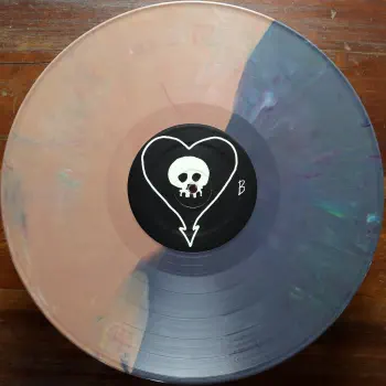 <u>PRESSING INFO</u><br><table class=inf_press><tbody><tr class=inf_info><td class=inf_title>Album:</td><td class=inf_info> Goddamnit Redux on Random Colour 'Half Purple / Half Salmon'  </td></tr>
    <td class=inf_title>Pressing:</td><td> Sixteenth Pressing /1000  </td></tr>
    <td class=inf_title>Release Date:</td><td> Feb. 15th 2021  </td></tr>
    <td class=inf_title>Album Pressed:</td><td> 2021  </td></tr>
    <td class=inf_title>Label:</td><td> Asianman Records AM-160  </td></tr>
    <td class=inf_title>Insert:</td><td> Double Sided Glossy  </td></tr>
    <td class=inf_title>Barcode:</td><td> 6 12851-01601 9  </td></tr>
    <td class=inf_title>Side A Matrix:</td><td> [etched] AM-160-A S-65748 [stamped] GOLDEN  </td></tr>
    <td class=inf_title>Side B Matrix:</td><td> [etched] AM-160-B S-65749 [stamped] GOLDEN  </td></tr>
    <td class=inf_title>&nbsp;</td><td> <a href=https://www.discogs.com/release/17544028-Alkaline-Trio-Goddamnit target=_blank rel=noopener noreferrer>View This Release on Discogs</a>  </tr></tbody></table>
<br><u>PRICING</u><span class='less' style='padding-left: 8px; color: var(--font-colour_grey);'>(prices shown in USD)</span><br><table class='inf_press'><tbody><tr class='inf_info'>
            <td class='inf_title'>Last Sold:</td>
            <td>$33.15 (Feb 7, 2025)</td>
            </tr><tr class='inf_info'>
            <td class='inf_title'>History:</td>
            <td>
                <span class='price-low' title='Sold on Aug 29, 2021'>Low: <span class='price-value'>$15.00</span></span>
                <span class='price-separator'>|</span>
                <span class='price-avg'>Avg: <span class='price-value'>$29.77</span></span>
                <span class='price-separator'>|</span>
                <span class='price-high' title='Sold on Jun 17, 2021'>High: <span class='price-value'>$39.99</span></span>
            </td>
            </tr></tbody></table><br>    <br><br><u>TRACKLIST</u><br><table class='inf_tracks'><tbody><tr>
            <td class='inf_num'>A1</td>
            <td class='inf_trk'>Cringe</td>
            <td class='inf_len'>2:23</td>
            <td><a href='#' class='lyric-link' data-album-code='gd' data-song-title='Cringe'>Lyrics</a></td></tr><tr>
            <td class='inf_num'>A2</td>
            <td class='inf_trk'>Cop</td>
            <td class='inf_len'>2:18</td>
            <td><a href='#' class='lyric-link' data-album-code='gd' data-song-title='Cop'>Lyrics</a></td></tr><tr>
            <td class='inf_num'>A3</td>
            <td class='inf_trk'>San Francisco</td>
            <td class='inf_len'>3:52</td>
            <td><a href='#' class='lyric-link' data-album-code='gd' data-song-title='San Francisco'>Lyrics</a></td></tr><tr>
            <td class='inf_num'>A4</td>
            <td class='inf_trk'>Nose Over Tail</td>
            <td class='inf_len'>2:37</td>
            <td><a href='#' class='lyric-link' data-album-code='gd' data-song-title='Nose Over Tail'>Lyrics</a></td></tr><tr>
            <td class='inf_num'>A5</td>
            <td class='inf_trk'>As You Were</td>
            <td class='inf_len'>2:11</td>
            <td><a href='#' class='lyric-link' data-album-code='gd' data-song-title='As You Were'>Lyrics</a></td></tr><tr>
            <td class='inf_num'>A6</td>
            <td class='inf_trk'>Enjoy Your Day</td>
            <td class='inf_len'>2:17</td>
            <td><a href='#' class='lyric-link' data-album-code='gd' data-song-title='Enjoy Your Day'>Lyrics</a></td></tr><tr>
            <td class='inf_num'>A7</td>
            <td class='inf_trk'>Clavicle</td>
            <td class='inf_len'>2:28</td>
            <td><a href='#' class='lyric-link' data-album-code='gd' data-song-title='Clavicle'>Lyrics</a></td></tr><tr>
            <td class='inf_num'>B1</td>
            <td class='inf_trk'>My Little Needle</td>
            <td class='inf_len'>3:01</td>
            <td><a href='#' class='lyric-link' data-album-code='gd' data-song-title='My Little Needle'>Lyrics</a></td></tr><tr>
            <td class='inf_num'>B2</td>
            <td class='inf_trk'>Southern Rock</td>
            <td class='inf_len'>3:05</td>
            <td><a href='#' class='lyric-link' data-album-code='gd' data-song-title='Southern Rock'>Lyrics</a></td></tr><tr>
            <td class='inf_num'>B3</td>
            <td class='inf_trk'>Message From Kathlene</td>
            <td class='inf_len'>3:22</td>
            <td><a href='#' class='lyric-link' data-album-code='gd' data-song-title='Message From Kathlene'>Lyrics</a></td></tr><tr>
            <td class='inf_num'>B4</td>
            <td class='inf_trk'>Trouble Breathing</td>
            <td class='inf_len'>3:55</td>
            <td><a href='#' class='lyric-link' data-album-code='gd' data-song-title='Trouble Breathing'>Lyrics</a></td></tr><tr>
            <td class='inf_num'>B5</td>
            <td class='inf_trk'>Sorry About That</td>
            <td class='inf_len'>3:21</td>
            <td><a href='#' class='lyric-link' data-album-code='gd' data-song-title='Sorry About That'>Lyrics</a></td></tr></tbody></table><br><br>
    <u>NOTES</u><br> Thin white border around insert. Former DVD order form is now covered by Heart/Skull logos. Center labels are black Heart/Skull logos. The sleeve of this release has a flat finish, compared to previous pressings that had glossy features.
 - B