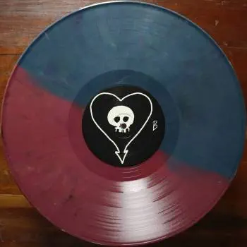 <u>PRESSING INFO</u><br><table class=inf_press><tbody><tr class=inf_info><td class=inf_title>Album:</td><td class=inf_info> Goddamnit Redux on Random Colour 'Half Red / Half Blue'  </td></tr>
    <td class=inf_title>Pressing:</td><td> Sixteenth Pressing /1000  </td></tr>
    <td class=inf_title>Release Date:</td><td> Feb. 15th 2021  </td></tr>
    <td class=inf_title>Album Pressed:</td><td> 2021  </td></tr>
    <td class=inf_title>Label:</td><td> Asianman Records AM-160  </td></tr>
    <td class=inf_title>Insert:</td><td> Double Sided Glossy  </td></tr>
    <td class=inf_title>Barcode:</td><td> 6 12851-01601 9  </td></tr>
    <td class=inf_title>Side A Matrix:</td><td> [etched] AM-160-A S-65748 [stamped] GOLDEN  </td></tr>
    <td class=inf_title>Side B Matrix:</td><td> [etched] AM-160-B S-65749 [stamped] GOLDEN  </td></tr>
    <td class=inf_title>&nbsp;</td><td> <a href=https://www.discogs.com/release/17544028-Alkaline-Trio-Goddamnit target=_blank rel=noopener noreferrer>View This Release on Discogs</a>  </tr></tbody></table>
<br><u>PRICING</u><span class='less' style='padding-left: 8px; color: var(--font-colour_grey);'>(prices shown in USD)</span><br><table class='inf_press'><tbody><tr class='inf_info'>
            <td class='inf_title'>Last Sold:</td>
            <td>$33.15 (Feb 7, 2025)</td>
            </tr><tr class='inf_info'>
            <td class='inf_title'>History:</td>
            <td>
                <span class='price-low' title='Sold on Aug 29, 2021'>Low: <span class='price-value'>$15.00</span></span>
                <span class='price-separator'>|</span>
                <span class='price-avg'>Avg: <span class='price-value'>$29.77</span></span>
                <span class='price-separator'>|</span>
                <span class='price-high' title='Sold on Jun 17, 2021'>High: <span class='price-value'>$39.99</span></span>
            </td>
            </tr></tbody></table><br>    <br><br><u>TRACKLIST</u><br><table class='inf_tracks'><tbody><tr>
            <td class='inf_num'>A1</td>
            <td class='inf_trk'>Cringe</td>
            <td class='inf_len'>2:23</td>
            <td><a href='#' class='lyric-link' data-album-code='gd' data-song-title='Cringe'>Lyrics</a></td></tr><tr>
            <td class='inf_num'>A2</td>
            <td class='inf_trk'>Cop</td>
            <td class='inf_len'>2:18</td>
            <td><a href='#' class='lyric-link' data-album-code='gd' data-song-title='Cop'>Lyrics</a></td></tr><tr>
            <td class='inf_num'>A3</td>
            <td class='inf_trk'>San Francisco</td>
            <td class='inf_len'>3:52</td>
            <td><a href='#' class='lyric-link' data-album-code='gd' data-song-title='San Francisco'>Lyrics</a></td></tr><tr>
            <td class='inf_num'>A4</td>
            <td class='inf_trk'>Nose Over Tail</td>
            <td class='inf_len'>2:37</td>
            <td><a href='#' class='lyric-link' data-album-code='gd' data-song-title='Nose Over Tail'>Lyrics</a></td></tr><tr>
            <td class='inf_num'>A5</td>
            <td class='inf_trk'>As You Were</td>
            <td class='inf_len'>2:11</td>
            <td><a href='#' class='lyric-link' data-album-code='gd' data-song-title='As You Were'>Lyrics</a></td></tr><tr>
            <td class='inf_num'>A6</td>
            <td class='inf_trk'>Enjoy Your Day</td>
            <td class='inf_len'>2:17</td>
            <td><a href='#' class='lyric-link' data-album-code='gd' data-song-title='Enjoy Your Day'>Lyrics</a></td></tr><tr>
            <td class='inf_num'>A7</td>
            <td class='inf_trk'>Clavicle</td>
            <td class='inf_len'>2:28</td>
            <td><a href='#' class='lyric-link' data-album-code='gd' data-song-title='Clavicle'>Lyrics</a></td></tr><tr>
            <td class='inf_num'>B1</td>
            <td class='inf_trk'>My Little Needle</td>
            <td class='inf_len'>3:01</td>
            <td><a href='#' class='lyric-link' data-album-code='gd' data-song-title='My Little Needle'>Lyrics</a></td></tr><tr>
            <td class='inf_num'>B2</td>
            <td class='inf_trk'>Southern Rock</td>
            <td class='inf_len'>3:05</td>
            <td><a href='#' class='lyric-link' data-album-code='gd' data-song-title='Southern Rock'>Lyrics</a></td></tr><tr>
            <td class='inf_num'>B3</td>
            <td class='inf_trk'>Message From Kathlene</td>
            <td class='inf_len'>3:22</td>
            <td><a href='#' class='lyric-link' data-album-code='gd' data-song-title='Message From Kathlene'>Lyrics</a></td></tr><tr>
            <td class='inf_num'>B4</td>
            <td class='inf_trk'>Trouble Breathing</td>
            <td class='inf_len'>3:55</td>
            <td><a href='#' class='lyric-link' data-album-code='gd' data-song-title='Trouble Breathing'>Lyrics</a></td></tr><tr>
            <td class='inf_num'>B5</td>
            <td class='inf_trk'>Sorry About That</td>
            <td class='inf_len'>3:21</td>
            <td><a href='#' class='lyric-link' data-album-code='gd' data-song-title='Sorry About That'>Lyrics</a></td></tr></tbody></table><br><br>
    <u>NOTES</u><br> Thin white border around insert. Former DVD order form is now covered by Heart/Skull logos. Center labels are black Heart/Skull logos. The sleeve of this release has a flat finish, compared to previous pressings that had glossy features.
 - B