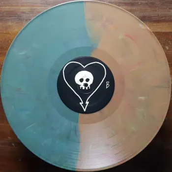 <u>PRESSING INFO</u><br><table class=inf_press><tbody><tr class=inf_info><td class=inf_title>Album:</td><td class=inf_info> Goddamnit Redux on Random Colour 'Half Teal / Half Copper'  </td></tr>
    <td class=inf_title>Pressing:</td><td> Sixteenth Pressing /1000  </td></tr>
    <td class=inf_title>Release Date:</td><td> Feb. 15th 2021  </td></tr>
    <td class=inf_title>Album Pressed:</td><td> 2021  </td></tr>
    <td class=inf_title>Label:</td><td> Asianman Records AM-160  </td></tr>
    <td class=inf_title>Insert:</td><td> Double Sided Glossy  </td></tr>
    <td class=inf_title>Barcode:</td><td> 6 12851-01601 9  </td></tr>
    <td class=inf_title>Side A Matrix:</td><td> [etched] AM-160-A S-65748 [stamped] GOLDEN  </td></tr>
    <td class=inf_title>Side B Matrix:</td><td> [etched] AM-160-B S-65749 [stamped] GOLDEN  </td></tr>
    <td class=inf_title>&nbsp;</td><td> <a href=https://www.discogs.com/release/17544028-Alkaline-Trio-Goddamnit target=_blank rel=noopener noreferrer>View This Release on Discogs</a>  </tr></tbody></table>
    <br><u>TRACKLIST</u><br><table class='inf_tracks'><tbody><tr>
            <td class='inf_num'>A1</td>
            <td class='inf_trk'>Cringe</td>
            <td class='inf_len'>2:23</td>
            <td><a href='#' class='lyric-link' data-album-code='gd' data-song-title='Cringe'>Lyrics</a></td></tr><tr>
            <td class='inf_num'>A2</td>
            <td class='inf_trk'>Cop</td>
            <td class='inf_len'>2:18</td>
            <td><a href='#' class='lyric-link' data-album-code='gd' data-song-title='Cop'>Lyrics</a></td></tr><tr>
            <td class='inf_num'>A3</td>
            <td class='inf_trk'>San Francisco</td>
            <td class='inf_len'>3:52</td>
            <td><a href='#' class='lyric-link' data-album-code='gd' data-song-title='San Francisco'>Lyrics</a></td></tr><tr>
            <td class='inf_num'>A4</td>
            <td class='inf_trk'>Nose Over Tail</td>
            <td class='inf_len'>2:37</td>
            <td><a href='#' class='lyric-link' data-album-code='gd' data-song-title='Nose Over Tail'>Lyrics</a></td></tr><tr>
            <td class='inf_num'>A5</td>
            <td class='inf_trk'>As You Were</td>
            <td class='inf_len'>2:11</td>
            <td><a href='#' class='lyric-link' data-album-code='gd' data-song-title='As You Were'>Lyrics</a></td></tr><tr>
            <td class='inf_num'>A6</td>
            <td class='inf_trk'>Enjoy Your Day</td>
            <td class='inf_len'>2:17</td>
            <td><a href='#' class='lyric-link' data-album-code='gd' data-song-title='Enjoy Your Day'>Lyrics</a></td></tr><tr>
            <td class='inf_num'>A7</td>
            <td class='inf_trk'>Clavicle</td>
            <td class='inf_len'>2:28</td>
            <td><a href='#' class='lyric-link' data-album-code='gd' data-song-title='Clavicle'>Lyrics</a></td></tr><tr>
            <td class='inf_num'>B1</td>
            <td class='inf_trk'>My Little Needle</td>
            <td class='inf_len'>3:01</td>
            <td><a href='#' class='lyric-link' data-album-code='gd' data-song-title='My Little Needle'>Lyrics</a></td></tr><tr>
            <td class='inf_num'>B2</td>
            <td class='inf_trk'>Southern Rock</td>
            <td class='inf_len'>3:05</td>
            <td><a href='#' class='lyric-link' data-album-code='gd' data-song-title='Southern Rock'>Lyrics</a></td></tr><tr>
            <td class='inf_num'>B3</td>
            <td class='inf_trk'>Message From Kathlene</td>
            <td class='inf_len'>3:22</td>
            <td><a href='#' class='lyric-link' data-album-code='gd' data-song-title='Message From Kathlene'>Lyrics</a></td></tr><tr>
            <td class='inf_num'>B4</td>
            <td class='inf_trk'>Trouble Breathing</td>
            <td class='inf_len'>3:55</td>
            <td><a href='#' class='lyric-link' data-album-code='gd' data-song-title='Trouble Breathing'>Lyrics</a></td></tr><tr>
            <td class='inf_num'>B5</td>
            <td class='inf_trk'>Sorry About That</td>
            <td class='inf_len'>3:21</td>
            <td><a href='#' class='lyric-link' data-album-code='gd' data-song-title='Sorry About That'>Lyrics</a></td></tr></tbody></table><br>
    <u>NOTES</u><br> Thin white border around insert. Former DVD order form is now covered by Heart/Skull logos. Center labels are black Heart/Skull logos. The sleeve of this release has a flat finish, compared to previous pressings that had glossy features.
 - B