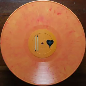 <u>PRESSING INFO</u><br><table class=inf_press><tbody><tr class=inf_info><td class=inf_title>Album:</td><td class=inf_info> Maybe I'll Catch Fire on Orange Marble  </td></tr>
    <td class=inf_title>Pressing:</td><td> First Pressing /1000  </td></tr>
    <td class=inf_title>Release Date:</td><td> 2000  </td></tr>
    <td class=inf_title>Album Pressed:</td><td> 2000  </td></tr>
    <td class=inf_title>Label:</td><td> Asianman Records AM 055  </td></tr>
    <td class=inf_title>Insert:</td><td> Double Sided Glossy  </td></tr>
    <td class=inf_title>Barcode:</td><td> 6 12851-0055-1 8  </td></tr>
    <td class=inf_title>Side A Matrix:</td><td> AM-055-A L-52603 GOLDEN  </td></tr>
    <td class=inf_title>Side B Matrix:</td><td> AM-055-B L-52603x GOLDEN  </td></tr>
    <td class=inf_title>&nbsp;</td><td> <a href=https://www.discogs.com/release/1427996 target=_blank rel=noopener noreferrer>View This Release on Discogs</a>  </tr></tbody></table>
<br><u>PRICING</u><span class='less' style='padding-left: 8px; color: var(--font-colour_grey);'>(prices shown in USD)</span><br><table class='inf_press'><tbody><tr class='inf_info'>
            <td class='inf_title'>Last Sold:</td>
            <td>$60.00 (Nov 11, 2025)</td>
            </tr><tr class='inf_info'>
            <td class='inf_title'>History:</td>
            <td>
                <span class='price-low' title='Sold on Jan 28, 2018'>Low: <span class='price-value'>$50.00</span></span>
                <span class='price-separator'>|</span>
                <span class='price-avg'>Avg: <span class='price-value'>$88.43</span></span>
                <span class='price-separator'>|</span>
                <span class='price-high' title='€140.00 · Sold on Jul 9, 2025'>High: <span class='price-value'>$159.45</span></span>
            </td>
            </tr></tbody></table><br>    <br><br><u>TRACKLIST</u><br><table class='inf_tracks'><tbody><tr>
            <td class='inf_num'>A1</td>
            <td class='inf_trk'>Keep ’Em Coming</td>
            <td class='inf_len'>4:10</td>
            <td><a href='#' class='lyric-link' data-album-code='micf' data-song-title='Keep ’Em Coming'>Lyrics</a></td></tr><tr>
            <td class='inf_num'>A2</td>
            <td class='inf_trk'>Madam Me</td>
            <td class='inf_len'>2:59</td>
            <td><a href='#' class='lyric-link' data-album-code='micf' data-song-title='Madam Me'>Lyrics</a></td></tr><tr>
            <td class='inf_num'>A3</td>
            <td class='inf_trk'>You’ve Got So Far To Go</td>
            <td class='inf_len'>3:14</td>
            <td><a href='#' class='lyric-link' data-album-code='micf' data-song-title='You’ve Got So Far To Go'>Lyrics</a></td></tr><tr>
            <td class='inf_num'>A4</td>
            <td class='inf_trk'>Fuck You Aurora</td>
            <td class='inf_len'>4:49</td>
            <td><a href='#' class='lyric-link' data-album-code='micf' data-song-title='Fuck You Aurora'>Lyrics</a></td></tr><tr>
            <td class='inf_num'>A5</td>
            <td class='inf_trk'>Sleepyhead</td>
            <td class='inf_len'>3:56</td>
            <td><a href='#' class='lyric-link' data-album-code='micf' data-song-title='Sleepyhead'>Lyrics</a></td></tr><tr>
            <td class='inf_num'>B1</td>
            <td class='inf_trk'>Maybe I’ll Catch Fire</td>
            <td class='inf_len'>3:07</td>
            <td><a href='#' class='lyric-link' data-album-code='micf' data-song-title='Maybe I’ll Catch Fire'>Lyrics</a></td></tr><tr>
            <td class='inf_num'>B2</td>
            <td class='inf_trk'>Tuck Me In</td>
            <td class='inf_len'>2:39</td>
            <td><a href='#' class='lyric-link' data-album-code='micf' data-song-title='Tuck Me In'>Lyrics</a></td></tr><tr>
            <td class='inf_num'>B3</td>
            <td class='inf_trk'>She Took Him To The Lake</td>
            <td class='inf_len'>2:40</td>
            <td><a href='#' class='lyric-link' data-album-code='micf' data-song-title='She Took Him To The Lake'>Lyrics</a></td></tr><tr>
            <td class='inf_num'>B4</td>
            <td class='inf_trk'>5-3-10-4</td>
            <td class='inf_len'>2:56</td>
            <td><a href='#' class='lyric-link' data-album-code='micf' data-song-title='5-3-10-4'>Lyrics</a></td></tr><tr>
            <td class='inf_num'>B5</td>
            <td class='inf_trk'>Radio</td>
            <td class='inf_len'>4:41</td>
            <td><a href='#' class='lyric-link' data-album-code='micf' data-song-title='Radio'>Lyrics</a></td></tr></tbody></table><br><br>
    <u>NOTES</u><br> The writing on this insert varies from later double sided glossy inserts.
 - B-orange