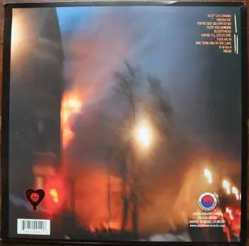 <u>PRESSING INFO</u><br><table class=inf_press><tbody><tr class=inf_info><td class=inf_title>Album:</td><td class=inf_info> Maybe I'll Catch Fire on Clear Orange with Black Swirl (Hot Topic Exclusive)  </td></tr>
    <td class=inf_title>Pressing:</td><td> Second Pressing /1000  </td></tr>
    <td class=inf_title>Release Date:</td><td> 2008  </td></tr>
    <td class=inf_title>Album Pressed:</td><td> 2008  </td></tr>
    <td class=inf_title>Label:</td><td> Asianman Records AM 055  </td></tr>
    <td class=inf_title>Insert:</td><td> Double Sided Matte  </td></tr>
    <td class=inf_title>Barcode:</td><td> 6 12851-0055-1 8  </td></tr>
    <td class=inf_title>Side A Matrix:</td><td> 1089-AM055- 1 A 5 S-65692  </td></tr>
    <td class=inf_title>Side B Matrix:</td><td> 7689-AM055-1(B) S-68693  </td></tr>
    <td class=inf_title>&nbsp;</td><td> <a href=https://www.discogs.com/release/1521898 target=_blank rel=noopener noreferrer>View This Release on Discogs</a>  </tr></tbody></table>
<br><u>PRICING</u><span class='less' style='padding-left: 8px; color: var(--font-colour_grey);'>(prices shown in USD)</span><br><table class='inf_press'><tbody><tr class='inf_info'>
            <td class='inf_title'>Last Sold:</td>
            <td>$12.80 (Apr 29, 2026)</td>
            </tr><tr class='inf_info'>
            <td class='inf_title'>History:</td>
            <td>
                <span class='price-low' title='Sold on Jun 26, 2016'>Low: <span class='price-value'>$8.29</span></span>
                <span class='price-separator'>|</span>
                <span class='price-avg'>Avg: <span class='price-value'>$26.18</span></span>
                <span class='price-separator'>|</span>
                <span class='price-high' title='€75.00 · Sold on Mar 25, 2021'>High: <span class='price-value'>$85.42</span></span>
            </td>
            </tr></tbody></table><br>    <br><br><u>TRACKLIST</u><br><table class='inf_tracks'><tbody><tr>
            <td class='inf_num'>A1</td>
            <td class='inf_trk'>Keep ’Em Coming</td>
            <td class='inf_len'>4:10</td>
            <td><a href='#' class='lyric-link' data-album-code='micf' data-song-title='Keep ’Em Coming'>Lyrics</a></td></tr><tr>
            <td class='inf_num'>A2</td>
            <td class='inf_trk'>Madam Me</td>
            <td class='inf_len'>2:59</td>
            <td><a href='#' class='lyric-link' data-album-code='micf' data-song-title='Madam Me'>Lyrics</a></td></tr><tr>
            <td class='inf_num'>A3</td>
            <td class='inf_trk'>You’ve Got So Far To Go</td>
            <td class='inf_len'>3:14</td>
            <td><a href='#' class='lyric-link' data-album-code='micf' data-song-title='You’ve Got So Far To Go'>Lyrics</a></td></tr><tr>
            <td class='inf_num'>A4</td>
            <td class='inf_trk'>Fuck You Aurora</td>
            <td class='inf_len'>4:49</td>
            <td><a href='#' class='lyric-link' data-album-code='micf' data-song-title='Fuck You Aurora'>Lyrics</a></td></tr><tr>
            <td class='inf_num'>A5</td>
            <td class='inf_trk'>Sleepyhead</td>
            <td class='inf_len'>3:56</td>
            <td><a href='#' class='lyric-link' data-album-code='micf' data-song-title='Sleepyhead'>Lyrics</a></td></tr><tr>
            <td class='inf_num'>B1</td>
            <td class='inf_trk'>Maybe I’ll Catch Fire</td>
            <td class='inf_len'>3:07</td>
            <td><a href='#' class='lyric-link' data-album-code='micf' data-song-title='Maybe I’ll Catch Fire'>Lyrics</a></td></tr><tr>
            <td class='inf_num'>B2</td>
            <td class='inf_trk'>Tuck Me In</td>
            <td class='inf_len'>2:39</td>
            <td><a href='#' class='lyric-link' data-album-code='micf' data-song-title='Tuck Me In'>Lyrics</a></td></tr><tr>
            <td class='inf_num'>B3</td>
            <td class='inf_trk'>She Took Him To The Lake</td>
            <td class='inf_len'>2:40</td>
            <td><a href='#' class='lyric-link' data-album-code='micf' data-song-title='She Took Him To The Lake'>Lyrics</a></td></tr><tr>
            <td class='inf_num'>B4</td>
            <td class='inf_trk'>5-3-10-4</td>
            <td class='inf_len'>2:56</td>
            <td><a href='#' class='lyric-link' data-album-code='micf' data-song-title='5-3-10-4'>Lyrics</a></td></tr><tr>
            <td class='inf_num'>B5</td>
            <td class='inf_trk'>Radio</td>
            <td class='inf_len'>4:41</td>
            <td><a href='#' class='lyric-link' data-album-code='micf' data-song-title='Radio'>Lyrics</a></td></tr></tbody></table><br><br>
    <u>NOTES</u><br> This is a Hot Topic Exclusive.
 - Back