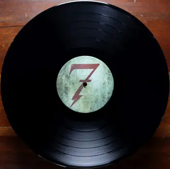 <u>PRESSING INFO</u><br><table class=inf_press><tbody><tr class=inf_info><td class=inf_title>Album:</td><td class=inf_info> This Addiction on US Black  </td></tr>
    <td class=inf_title>Pressing:</td><td> First Pressing /??  </td></tr>
    <td class=inf_title>Release Date:</td><td> Feb. 23rd 2010  </td></tr>
    <td class=inf_title>Album Pressed:</td><td> 2010  </td></tr>
    <td class=inf_title>Label:</td><td> Heart&Skull Records/Epitaph 87075-1  </td></tr>
    <td class=inf_title>Insert:</td><td> Printed Satin Inner Sleeve  </td></tr>
    <td class=inf_title>Barcode:</td><td> 0 45778-70751 5  </td></tr>
    <td class=inf_title>Side A Matrix:</td><td> 87075-A RJ STERLING  </td></tr>
    <td class=inf_title>Side B Matrix:</td><td> 87075-B RJ STERLING  </td></tr>
    <td class=inf_title>&nbsp;</td><td> <a href=https://www.discogs.com/release/2153057 target=_blank rel=noopener noreferrer>View This Release on Discogs</a>  </tr></tbody></table>
<br><u>PRICING</u><span class='less' style='padding-left: 8px; color: var(--font-colour_grey);'>(prices shown in USD)</span><br><table class='inf_press'><tbody><tr class='inf_info'>
            <td class='inf_title'>Last Sold:</td>
            <td><span title='Sold for €12.00'>$13.67</span> (Jun 16, 2026)</td>
            </tr><tr class='inf_info'>
            <td class='inf_title'>History:</td>
            <td>
                <span class='price-low' title='€12.00 · Sold on Jun 16, 2026'>Low: <span class='price-value'>$13.67</span></span>
                <span class='price-separator'>|</span>
                <span class='price-avg'>Avg: <span class='price-value'>$19.93</span></span>
                <span class='price-separator'>|</span>
                <span class='price-high' title='A$62.00 · Sold on Feb 28, 2024'>High: <span class='price-value'>$43.40</span></span>
            </td>
            </tr></tbody></table><br>    <br><br><u>TRACKLIST</u><br><table class='inf_tracks'><tbody><tr>
            <td class='inf_num'>A1</td>
            <td class='inf_trk'>This Addiction</td>
            <td class='inf_len'>2:35</td>
            <td><a href='#' class='lyric-link' data-album-code='ta' data-song-title='This Addiction'>Lyrics</a></td></tr><tr>
            <td class='inf_num'>A2</td>
            <td class='inf_trk'>Dine, Dine My Darling</td>
            <td class='inf_len'>2:58</td>
            <td><a href='#' class='lyric-link' data-album-code='ta' data-song-title='Dine, Dine My Darling'>Lyrics</a></td></tr><tr>
            <td class='inf_num'>A3</td>
            <td class='inf_trk'>Lead Poisoning</td>
            <td class='inf_len'>2:37</td>
            <td><a href='#' class='lyric-link' data-album-code='ta' data-song-title='Lead Poisoning'>Lyrics</a></td></tr><tr>
            <td class='inf_num'>A4</td>
            <td class='inf_trk'>Dead On The Floor</td>
            <td class='inf_len'>4:20</td>
            <td><a href='#' class='lyric-link' data-album-code='ta' data-song-title='Dead On The Floor'>Lyrics</a></td></tr><tr>
            <td class='inf_num'>A5</td>
            <td class='inf_trk'>The American Scream</td>
            <td class='inf_len'>3:00</td>
            <td><a href='#' class='lyric-link' data-album-code='ta' data-song-title='The American Scream'>Lyrics</a></td></tr><tr>
            <td class='inf_num'>A6</td>
            <td class='inf_trk'>Off The Map</td>
            <td class='inf_len'>3:16</td>
            <td><a href='#' class='lyric-link' data-album-code='ta' data-song-title='Off The Map'>Lyrics</a></td></tr><tr>
            <td class='inf_num'>B1</td>
            <td class='inf_trk'>Draculina</td>
            <td class='inf_len'>3:34</td>
            <td><a href='#' class='lyric-link' data-album-code='ta' data-song-title='Draculina'>Lyrics</a></td></tr><tr>
            <td class='inf_num'>B2</td>
            <td class='inf_trk'>Eating Me Alive</td>
            <td class='inf_len'>2:53</td>
            <td><a href='#' class='lyric-link' data-album-code='ta' data-song-title='Eating Me Alive'>Lyrics</a></td></tr><tr>
            <td class='inf_num'>B3</td>
            <td class='inf_trk'>Piss And Vinegar</td>
            <td class='inf_len'>2:28</td>
            <td><a href='#' class='lyric-link' data-album-code='ta' data-song-title='Piss And Vinegar'>Lyrics</a></td></tr><tr>
            <td class='inf_num'>B4</td>
            <td class='inf_trk'>Dorothy</td>
            <td class='inf_len'>3:32</td>
            <td><a href='#' class='lyric-link' data-album-code='ta' data-song-title='Dorothy'>Lyrics</a></td></tr><tr>
            <td class='inf_num'>B5</td>
            <td class='inf_trk'>Fine</td>
            <td class='inf_len'>3:17</td>
            <td><a href='#' class='lyric-link' data-album-code='ta' data-song-title='Fine'>Lyrics</a></td></tr></tbody></table><br><br>
    <u>NOTES</u><br> Gatefold sleeve. Printed inner sleeve. Clear w white text hype sticker on lower right corner of shrink.
 - B