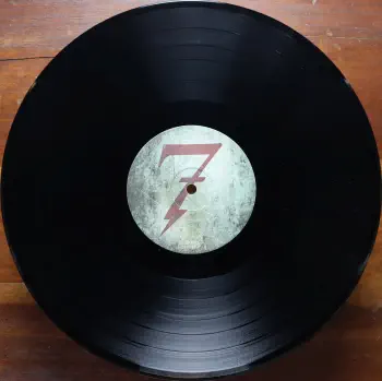 <u>PRESSING INFO</u><br><table class=inf_press><tbody><tr class=inf_info><td class=inf_title>Album:</td><td class=inf_info> This Addiction on UK Black  </td></tr>
    <td class=inf_title>Pressing:</td><td> First Pressing /??  </td></tr>
    <td class=inf_title>Release Date:</td><td> Feb. 23rd 2010  </td></tr>
    <td class=inf_title>Album Pressed:</td><td> 2010  </td></tr>
    <td class=inf_title>Label:</td><td> Heart&Skull Records/Hassle Records HOFF 092LP  </td></tr>
    <td class=inf_title>Insert:</td><td> Printed Glossy Inner Sleeve  </td></tr>
    <td class=inf_title>Barcode:</td><td> 5 060100-667867  </td></tr>
    <td class=inf_title>Side A Matrix:</td><td> HOFF 092 LP.A1  </td></tr>
    <td class=inf_title>Side B Matrix:</td><td> HOFF 092 LP.B1  </td></tr>
    <td class=inf_title>&nbsp;</td><td> <a href=https://www.discogs.com/release/3722699 target=_blank rel=noopener noreferrer>View This Release on Discogs</a>  </tr></tbody></table>
<br><u>PRICING</u><span class='less' style='padding-left: 8px; color: var(--font-colour_grey);'>(prices shown in USD)</span><br><table class='inf_press'><tbody><tr class='inf_info'>
            <td class='inf_title'>Last Sold:</td>
            <td>$19.57 (Feb 21, 2026)</td>
            </tr><tr class='inf_info'>
            <td class='inf_title'>History:</td>
            <td>
                <span class='price-low' title='£10.00 · Sold on Jun 25, 2023'>Low: <span class='price-value'>$13.32</span></span>
                <span class='price-separator'>|</span>
                <span class='price-avg'>Avg: <span class='price-value'>$23.86</span></span>
                <span class='price-separator'>|</span>
                <span class='price-high' title='£39.99 · Sold on Oct 20, 2022'>High: <span class='price-value'>$53.25</span></span>
            </td>
            </tr></tbody></table><br>    <br><br><u>TRACKLIST</u><br><table class='inf_tracks'><tbody><tr>
            <td class='inf_num'>A1</td>
            <td class='inf_trk'>This Addiction</td>
            <td class='inf_len'>2:35</td>
            <td><a href='#' class='lyric-link' data-album-code='ta' data-song-title='This Addiction'>Lyrics</a></td></tr><tr>
            <td class='inf_num'>A2</td>
            <td class='inf_trk'>Dine, Dine My Darling</td>
            <td class='inf_len'>2:58</td>
            <td><a href='#' class='lyric-link' data-album-code='ta' data-song-title='Dine, Dine My Darling'>Lyrics</a></td></tr><tr>
            <td class='inf_num'>A3</td>
            <td class='inf_trk'>Lead Poisoning</td>
            <td class='inf_len'>2:37</td>
            <td><a href='#' class='lyric-link' data-album-code='ta' data-song-title='Lead Poisoning'>Lyrics</a></td></tr><tr>
            <td class='inf_num'>A4</td>
            <td class='inf_trk'>Dead On The Floor</td>
            <td class='inf_len'>4:20</td>
            <td><a href='#' class='lyric-link' data-album-code='ta' data-song-title='Dead On The Floor'>Lyrics</a></td></tr><tr>
            <td class='inf_num'>A5</td>
            <td class='inf_trk'>The American Scream</td>
            <td class='inf_len'>3:00</td>
            <td><a href='#' class='lyric-link' data-album-code='ta' data-song-title='The American Scream'>Lyrics</a></td></tr><tr>
            <td class='inf_num'>A6</td>
            <td class='inf_trk'>Off The Map</td>
            <td class='inf_len'>3:16</td>
            <td><a href='#' class='lyric-link' data-album-code='ta' data-song-title='Off The Map'>Lyrics</a></td></tr><tr>
            <td class='inf_num'>B1</td>
            <td class='inf_trk'>Draculina</td>
            <td class='inf_len'>3:34</td>
            <td><a href='#' class='lyric-link' data-album-code='ta' data-song-title='Draculina'>Lyrics</a></td></tr><tr>
            <td class='inf_num'>B2</td>
            <td class='inf_trk'>Eating Me Alive</td>
            <td class='inf_len'>2:53</td>
            <td><a href='#' class='lyric-link' data-album-code='ta' data-song-title='Eating Me Alive'>Lyrics</a></td></tr><tr>
            <td class='inf_num'>B3</td>
            <td class='inf_trk'>Piss And Vinegar</td>
            <td class='inf_len'>2:28</td>
            <td><a href='#' class='lyric-link' data-album-code='ta' data-song-title='Piss And Vinegar'>Lyrics</a></td></tr><tr>
            <td class='inf_num'>B4</td>
            <td class='inf_trk'>Dorothy</td>
            <td class='inf_len'>3:32</td>
            <td><a href='#' class='lyric-link' data-album-code='ta' data-song-title='Dorothy'>Lyrics</a></td></tr><tr>
            <td class='inf_num'>B5</td>
            <td class='inf_trk'>Fine</td>
            <td class='inf_len'>3:17</td>
            <td><a href='#' class='lyric-link' data-album-code='ta' data-song-title='Fine'>Lyrics</a></td></tr></tbody></table><br><br>
    <u>NOTES</u><br> Gatefold sleeve (higher gloss than US release). Printed inner sleeve (higher gloss and printed on heavier cardstock than US release). White w Black text hype sticker on upper left corner of shrink. Hassle Records markings on sleeve and center labels. Alkaline Trio text on spine is smaller and cat# / heartskull logo placement on spine is different than the US release.
 - B