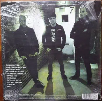 <u>PRESSING INFO</u><br><table class=inf_press><tbody><tr class=inf_info><td class=inf_title>Album:</td><td class=inf_info> This Addiction on UK Black  </td></tr>
    <td class=inf_title>Pressing:</td><td> First Pressing /??  </td></tr>
    <td class=inf_title>Release Date:</td><td> Feb. 23rd 2010  </td></tr>
    <td class=inf_title>Album Pressed:</td><td> 2010  </td></tr>
    <td class=inf_title>Label:</td><td> Heart&Skull Records/Hassle Records HOFF 092LP  </td></tr>
    <td class=inf_title>Insert:</td><td> Printed Glossy Inner Sleeve  </td></tr>
    <td class=inf_title>Barcode:</td><td> 5 060100-667867  </td></tr>
    <td class=inf_title>Side A Matrix:</td><td> HOFF 092 LP.A1  </td></tr>
    <td class=inf_title>Side B Matrix:</td><td> HOFF 092 LP.B1  </td></tr>
    <td class=inf_title>&nbsp;</td><td> <a href=https://www.discogs.com/release/3722699 target=_blank rel=noopener noreferrer>View This Release on Discogs</a>  </tr></tbody></table>
<br><u>PRICING</u><span class='less' style='padding-left: 8px; color: var(--font-colour_grey);'>(prices shown in USD)</span><br><table class='inf_press'><tbody><tr class='inf_info'>
            <td class='inf_title'>Last Sold:</td>
            <td>$19.57 (Feb 21, 2026)</td>
            </tr><tr class='inf_info'>
            <td class='inf_title'>History:</td>
            <td>
                <span class='price-low' title='£10.00 · Sold on Jun 25, 2023'>Low: <span class='price-value'>$13.32</span></span>
                <span class='price-separator'>|</span>
                <span class='price-avg'>Avg: <span class='price-value'>$23.86</span></span>
                <span class='price-separator'>|</span>
                <span class='price-high' title='£39.99 · Sold on Oct 20, 2022'>High: <span class='price-value'>$53.25</span></span>
            </td>
            </tr></tbody></table><br>    <br><br><u>TRACKLIST</u><br><table class='inf_tracks'><tbody><tr>
            <td class='inf_num'>A1</td>
            <td class='inf_trk'>This Addiction</td>
            <td class='inf_len'>2:35</td>
            <td><a href='#' class='lyric-link' data-album-code='ta' data-song-title='This Addiction'>Lyrics</a></td></tr><tr>
            <td class='inf_num'>A2</td>
            <td class='inf_trk'>Dine, Dine My Darling</td>
            <td class='inf_len'>2:58</td>
            <td><a href='#' class='lyric-link' data-album-code='ta' data-song-title='Dine, Dine My Darling'>Lyrics</a></td></tr><tr>
            <td class='inf_num'>A3</td>
            <td class='inf_trk'>Lead Poisoning</td>
            <td class='inf_len'>2:37</td>
            <td><a href='#' class='lyric-link' data-album-code='ta' data-song-title='Lead Poisoning'>Lyrics</a></td></tr><tr>
            <td class='inf_num'>A4</td>
            <td class='inf_trk'>Dead On The Floor</td>
            <td class='inf_len'>4:20</td>
            <td><a href='#' class='lyric-link' data-album-code='ta' data-song-title='Dead On The Floor'>Lyrics</a></td></tr><tr>
            <td class='inf_num'>A5</td>
            <td class='inf_trk'>The American Scream</td>
            <td class='inf_len'>3:00</td>
            <td><a href='#' class='lyric-link' data-album-code='ta' data-song-title='The American Scream'>Lyrics</a></td></tr><tr>
            <td class='inf_num'>A6</td>
            <td class='inf_trk'>Off The Map</td>
            <td class='inf_len'>3:16</td>
            <td><a href='#' class='lyric-link' data-album-code='ta' data-song-title='Off The Map'>Lyrics</a></td></tr><tr>
            <td class='inf_num'>B1</td>
            <td class='inf_trk'>Draculina</td>
            <td class='inf_len'>3:34</td>
            <td><a href='#' class='lyric-link' data-album-code='ta' data-song-title='Draculina'>Lyrics</a></td></tr><tr>
            <td class='inf_num'>B2</td>
            <td class='inf_trk'>Eating Me Alive</td>
            <td class='inf_len'>2:53</td>
            <td><a href='#' class='lyric-link' data-album-code='ta' data-song-title='Eating Me Alive'>Lyrics</a></td></tr><tr>
            <td class='inf_num'>B3</td>
            <td class='inf_trk'>Piss And Vinegar</td>
            <td class='inf_len'>2:28</td>
            <td><a href='#' class='lyric-link' data-album-code='ta' data-song-title='Piss And Vinegar'>Lyrics</a></td></tr><tr>
            <td class='inf_num'>B4</td>
            <td class='inf_trk'>Dorothy</td>
            <td class='inf_len'>3:32</td>
            <td><a href='#' class='lyric-link' data-album-code='ta' data-song-title='Dorothy'>Lyrics</a></td></tr><tr>
            <td class='inf_num'>B5</td>
            <td class='inf_trk'>Fine</td>
            <td class='inf_len'>3:17</td>
            <td><a href='#' class='lyric-link' data-album-code='ta' data-song-title='Fine'>Lyrics</a></td></tr></tbody></table><br><br>
    <u>NOTES</u><br> Gatefold sleeve (higher gloss than US release). Printed inner sleeve (higher gloss and printed on heavier cardstock than US release). White w Black text hype sticker on upper left corner of shrink. Hassle Records markings on sleeve and center labels. Alkaline Trio text on spine is smaller and cat# / heartskull logo placement on spine is different than the US release.
 - Back