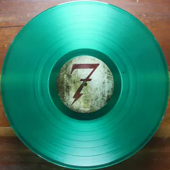 <u>PRESSING INFO</u><br><table class=inf_press><tbody><tr class=inf_info><td class=inf_title>Album:</td><td class=inf_info> This Addiction on Clear Green  </td></tr>
    <td class=inf_title>Pressing:</td><td> First Pressing /1000  </td></tr>
    <td class=inf_title>Release Date:</td><td> Feb. 23rd 2010  </td></tr>
    <td class=inf_title>Album Pressed:</td><td> 2010  </td></tr>
    <td class=inf_title>Label:</td><td> Heart&Skull Records/Epitaph 87075-1  </td></tr>
    <td class=inf_title>Insert:</td><td> Printed Satin Inner Sleeve  </td></tr>
    <td class=inf_title>Barcode:</td><td> 0 45778-70751 5  </td></tr>
    <td class=inf_title>Side A Matrix:</td><td> 87075-A RJ STERLING  </td></tr>
    <td class=inf_title>Side B Matrix:</td><td> 87075-B RJ STERLING  </td></tr>
    <td class=inf_title>&nbsp;</td><td> <a href=https://www.discogs.com/release/2153106 target=_blank rel=noopener noreferrer>View This Release on Discogs</a>  </tr></tbody></table>
<br><u>PRICING</u><span class='less' style='padding-left: 8px; color: var(--font-colour_grey);'>(prices shown in USD)</span><br><table class='inf_press'><tbody><tr class='inf_info'>
            <td class='inf_title'>Last Sold:</td>
            <td>$32.00 (Dec 18, 2025)</td>
            </tr><tr class='inf_info'>
            <td class='inf_title'>History:</td>
            <td>
                <span class='price-low' title='Sold on Oct 24, 2019'>Low: <span class='price-value'>$26.00</span></span>
                <span class='price-separator'>|</span>
                <span class='price-avg'>Avg: <span class='price-value'>$48.33</span></span>
                <span class='price-separator'>|</span>
                <span class='price-high' title='Sold on Sep 30, 2022'>High: <span class='price-value'>$84.99</span></span>
            </td>
            </tr></tbody></table><br>    <br><br><u>TRACKLIST</u><br><table class='inf_tracks'><tbody><tr>
            <td class='inf_num'>A1</td>
            <td class='inf_trk'>This Addiction</td>
            <td class='inf_len'>2:35</td>
            <td><a href='#' class='lyric-link' data-album-code='ta' data-song-title='This Addiction'>Lyrics</a></td></tr><tr>
            <td class='inf_num'>A2</td>
            <td class='inf_trk'>Dine, Dine My Darling</td>
            <td class='inf_len'>2:58</td>
            <td><a href='#' class='lyric-link' data-album-code='ta' data-song-title='Dine, Dine My Darling'>Lyrics</a></td></tr><tr>
            <td class='inf_num'>A3</td>
            <td class='inf_trk'>Lead Poisoning</td>
            <td class='inf_len'>2:37</td>
            <td><a href='#' class='lyric-link' data-album-code='ta' data-song-title='Lead Poisoning'>Lyrics</a></td></tr><tr>
            <td class='inf_num'>A4</td>
            <td class='inf_trk'>Dead On The Floor</td>
            <td class='inf_len'>4:20</td>
            <td><a href='#' class='lyric-link' data-album-code='ta' data-song-title='Dead On The Floor'>Lyrics</a></td></tr><tr>
            <td class='inf_num'>A5</td>
            <td class='inf_trk'>The American Scream</td>
            <td class='inf_len'>3:00</td>
            <td><a href='#' class='lyric-link' data-album-code='ta' data-song-title='The American Scream'>Lyrics</a></td></tr><tr>
            <td class='inf_num'>A6</td>
            <td class='inf_trk'>Off The Map</td>
            <td class='inf_len'>3:16</td>
            <td><a href='#' class='lyric-link' data-album-code='ta' data-song-title='Off The Map'>Lyrics</a></td></tr><tr>
            <td class='inf_num'>B1</td>
            <td class='inf_trk'>Draculina</td>
            <td class='inf_len'>3:34</td>
            <td><a href='#' class='lyric-link' data-album-code='ta' data-song-title='Draculina'>Lyrics</a></td></tr><tr>
            <td class='inf_num'>B2</td>
            <td class='inf_trk'>Eating Me Alive</td>
            <td class='inf_len'>2:53</td>
            <td><a href='#' class='lyric-link' data-album-code='ta' data-song-title='Eating Me Alive'>Lyrics</a></td></tr><tr>
            <td class='inf_num'>B3</td>
            <td class='inf_trk'>Piss And Vinegar</td>
            <td class='inf_len'>2:28</td>
            <td><a href='#' class='lyric-link' data-album-code='ta' data-song-title='Piss And Vinegar'>Lyrics</a></td></tr><tr>
            <td class='inf_num'>B4</td>
            <td class='inf_trk'>Dorothy</td>
            <td class='inf_len'>3:32</td>
            <td><a href='#' class='lyric-link' data-album-code='ta' data-song-title='Dorothy'>Lyrics</a></td></tr><tr>
            <td class='inf_num'>B5</td>
            <td class='inf_trk'>Fine</td>
            <td class='inf_len'>3:17</td>
            <td><a href='#' class='lyric-link' data-album-code='ta' data-song-title='Fine'>Lyrics</a></td></tr></tbody></table><br><br>
    <u>NOTES</u><br> Gatefold sleeve. Printed inner sleeve. I believe this came with a hype sticker that matched the Black US release, but my copy no longer has the shrink to verify. Center labels have Made in Canada printed and have darker coloring than those without the Made in Canada text.
 - B