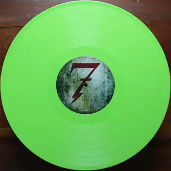 <u>PRESSING INFO</u><br><table class=inf_press><tbody><tr class=inf_info><td class=inf_title>Album:</td><td class=inf_info> This Addiction on Toxic Green (KingsRoadMerch Exclusive)  </td></tr>
    <td class=inf_title>Pressing:</td><td> Second Pressing /1000  </td></tr>
    <td class=inf_title>Release Date:</td><td> Feb. 10th 2023  </td></tr>
    <td class=inf_title>Album Pressed:</td><td> 2023  </td></tr>
    <td class=inf_title>Label:</td><td> Heart&Skull Records/Epitaph 87075-1  </td></tr>
    <td class=inf_title>Insert:</td><td> Printed Satin Inner Sleeve  </td></tr>
    <td class=inf_title>Barcode:</td><td> 0 45778-70751 5  </td></tr>
    <td class=inf_title>Side A Matrix:</td><td> ALKALINE TRIO - THIS ADDICTION EPITAPH 87075-1 2017 A  </td></tr>
    <td class=inf_title>Side B Matrix:</td><td> ALKALINE TRIO - THIS ADDICTION EPITAPH 87075-1 2017 B  </td></tr>
    <td class=inf_title>&nbsp;</td><td> <a href=https://www.discogs.com/release/26278778 target=_blank rel=noopener noreferrer>View This Release on Discogs</a>  </tr></tbody></table>
<br><u>PRICING</u><span class='less' style='padding-left: 8px; color: var(--font-colour_grey);'>(prices shown in USD)</span><br><table class='inf_press'><tbody><tr class='inf_info'>
            <td class='inf_title'>Last Sold:</td>
            <td>$35.00 (Mar 27, 2026)</td>
            </tr><tr class='inf_info'>
            <td class='inf_title'>History:</td>
            <td>
                <span class='price-low' title='Sold on Feb 28, 2026'>Low: <span class='price-value'>$31.99</span></span>
                <span class='price-separator'>|</span>
                <span class='price-avg'>Avg: <span class='price-value'>$41.39</span></span>
                <span class='price-separator'>|</span>
                <span class='price-high' title='Sold on Feb 3, 2026'>High: <span class='price-value'>$49.99</span></span>
            </td>
            </tr></tbody></table><br>    <br><br><u>TRACKLIST</u><br><table class='inf_tracks'><tbody><tr>
            <td class='inf_num'>A1</td>
            <td class='inf_trk'>This Addiction</td>
            <td class='inf_len'>2:35</td>
            <td><a href='#' class='lyric-link' data-album-code='ta' data-song-title='This Addiction'>Lyrics</a></td></tr><tr>
            <td class='inf_num'>A2</td>
            <td class='inf_trk'>Dine, Dine My Darling</td>
            <td class='inf_len'>2:58</td>
            <td><a href='#' class='lyric-link' data-album-code='ta' data-song-title='Dine, Dine My Darling'>Lyrics</a></td></tr><tr>
            <td class='inf_num'>A3</td>
            <td class='inf_trk'>Lead Poisoning</td>
            <td class='inf_len'>2:37</td>
            <td><a href='#' class='lyric-link' data-album-code='ta' data-song-title='Lead Poisoning'>Lyrics</a></td></tr><tr>
            <td class='inf_num'>A4</td>
            <td class='inf_trk'>Dead On The Floor</td>
            <td class='inf_len'>4:20</td>
            <td><a href='#' class='lyric-link' data-album-code='ta' data-song-title='Dead On The Floor'>Lyrics</a></td></tr><tr>
            <td class='inf_num'>A5</td>
            <td class='inf_trk'>The American Scream</td>
            <td class='inf_len'>3:00</td>
            <td><a href='#' class='lyric-link' data-album-code='ta' data-song-title='The American Scream'>Lyrics</a></td></tr><tr>
            <td class='inf_num'>A6</td>
            <td class='inf_trk'>Off The Map</td>
            <td class='inf_len'>3:16</td>
            <td><a href='#' class='lyric-link' data-album-code='ta' data-song-title='Off The Map'>Lyrics</a></td></tr><tr>
            <td class='inf_num'>B1</td>
            <td class='inf_trk'>Draculina</td>
            <td class='inf_len'>3:34</td>
            <td><a href='#' class='lyric-link' data-album-code='ta' data-song-title='Draculina'>Lyrics</a></td></tr><tr>
            <td class='inf_num'>B2</td>
            <td class='inf_trk'>Eating Me Alive</td>
            <td class='inf_len'>2:53</td>
            <td><a href='#' class='lyric-link' data-album-code='ta' data-song-title='Eating Me Alive'>Lyrics</a></td></tr><tr>
            <td class='inf_num'>B3</td>
            <td class='inf_trk'>Piss And Vinegar</td>
            <td class='inf_len'>2:28</td>
            <td><a href='#' class='lyric-link' data-album-code='ta' data-song-title='Piss And Vinegar'>Lyrics</a></td></tr><tr>
            <td class='inf_num'>B4</td>
            <td class='inf_trk'>Dorothy</td>
            <td class='inf_len'>3:32</td>
            <td><a href='#' class='lyric-link' data-album-code='ta' data-song-title='Dorothy'>Lyrics</a></td></tr><tr>
            <td class='inf_num'>B5</td>
            <td class='inf_trk'>Fine</td>
            <td class='inf_len'>3:17</td>
            <td><a href='#' class='lyric-link' data-album-code='ta' data-song-title='Fine'>Lyrics</a></td></tr></tbody></table><br><br>
    <u>NOTES</u><br> Gatefold sleeve. Labels without Made in Canada
 - B