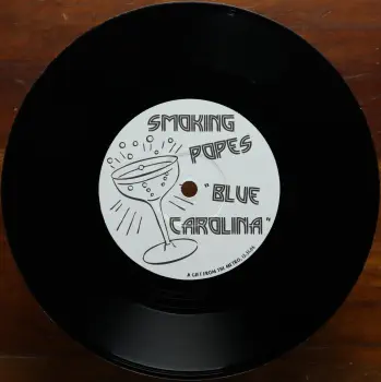 <u>PRESSING INFO</u><br><table class=inf_press><tbody><tr class=inf_info><td class=inf_title>Album:</td><td class=inf_info> Alkaline Trio / Smoking Popes New Years Eve Split on Black  </td></tr>
    <td class=inf_title>Pressing:</td><td> First Pressing /??  </td></tr>
    <td class=inf_title>Release Date:</td><td> Dec. 31st 2006  </td></tr>
    <td class=inf_title>Album Pressed:</td><td> 2006  </td></tr>
    <td class=inf_title>Label:</td><td> Metro Chicago MET001  </td></tr>
    <td class=inf_title>Insert:</td><td> none  </td></tr>
    <td class=inf_title>Barcode:</td><td> none  </td></tr>
    <td class=inf_title>Side A Matrix:</td><td> RECORDPRESSING.COM MET001 A 69019H1/A  </td></tr>
    <td class=inf_title>Side B Matrix:</td><td> RECORDPRESSING.COM MET001 B 69019H2/A  </td></tr>
    <td class=inf_title>&nbsp;</td><td> <a href=https://www.discogs.com/release/1046180 target=_blank rel=noopener noreferrer>View This Release on Discogs</a>  </tr></tbody></table>
<br><u>PRICING</u><span class='less' style='padding-left: 8px; color: var(--font-colour_grey);'>(prices shown in USD)</span><br><table class='inf_press'><tbody><tr class='inf_info'>
            <td class='inf_title'>Last Sold:</td>
            <td>$130.00 (Feb 5, 2026)</td>
            </tr><tr class='inf_info'>
            <td class='inf_title'>History:</td>
            <td>
                <span class='price-low' title='Sold on Mar 5, 2013'>Low: <span class='price-value'>$40.00</span></span>
                <span class='price-separator'>|</span>
                <span class='price-avg'>Avg: <span class='price-value'>$83.27</span></span>
                <span class='price-separator'>|</span>
                <span class='price-high' title='Sold on Feb 1, 2023'>High: <span class='price-value'>$150.00</span></span>
            </td>
            </tr></tbody></table><br>    <br><br><u>TRACKLIST</u><br><table class='inf_tracks'><tbody><tr>
            <td class='inf_num'>A1</td>
            <td class='inf_trk'>Alkaline Trio - Off My Mind</td>
            <td class='inf_len'>?:??</td>
            <td><a href='#' class='lyric-link' data-album-code='splits' data-song-title='Alkaline Trio - Off My Mind'>Lyrics</a></td></tr><tr>
            <td class='inf_num'>B1</td>
            <td class='inf_trk'>Smoking Popes - Blue Carolina</td>
            <td class='inf_len'>?:??</td>
            <td><a href='#' class='lyric-link' data-album-code='splits' data-song-title='Smoking Popes - Blue Carolina'>Lyrics</a></td></tr></tbody></table><br><br>
    <u>NOTES</u><br> Copies were handed out to attendees of the 12/31/2006 New Years Eve show at @metrochicago . Each band covers the other for 1 track each.
 - B